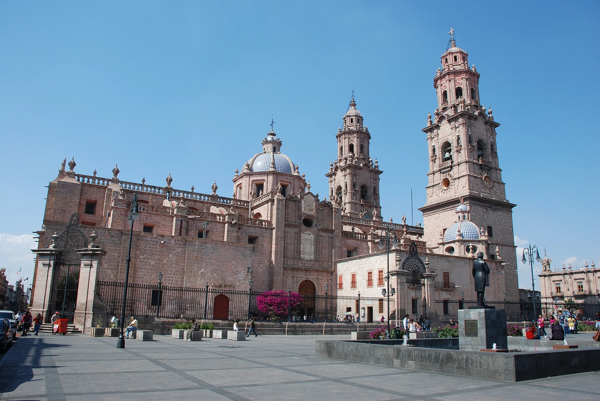 Morelia Cathedral's pink-stone towers and tiled dome above the plaza, Michoacán