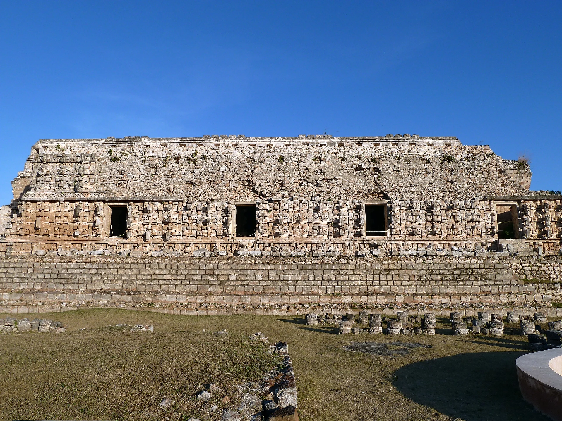 Façade of the Codz Poop, covered in Chaac masks, at Kabah, Yucatán