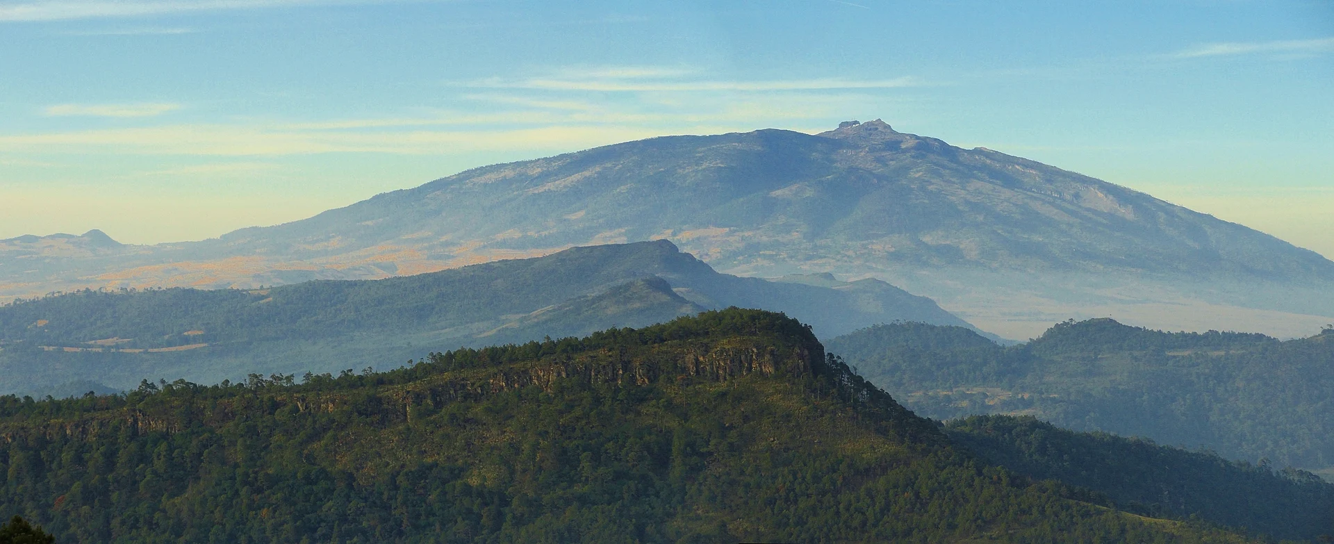 The broad summit of the Cofre de Perote above forested ridges, Veracruz