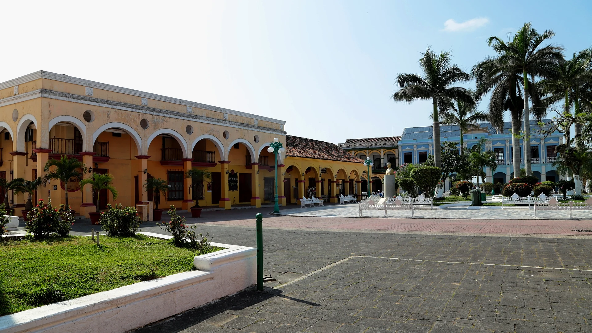 Arcaded, colour-washed buildings and royal palms around the main square of Tlacotalpan, Veracruz