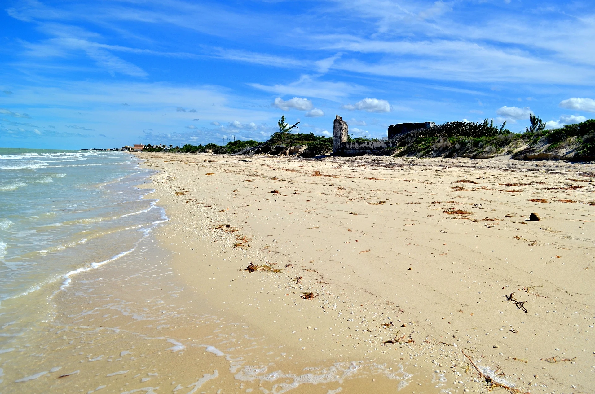 The wide sandy beach at Chuburná Puerto on a clear day, Yucatán