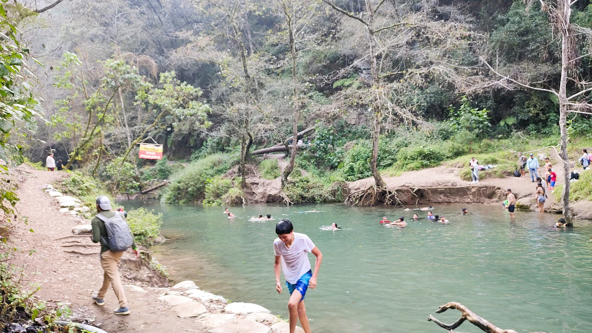 Swimmers in the turquoise pool of Pancho Poza, Altotonga, Puebla