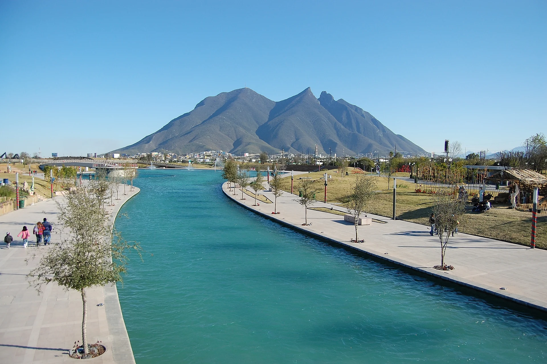 The Paseo Santa Lucía canal with the Cerro de la Silla in the distance, Nuevo León