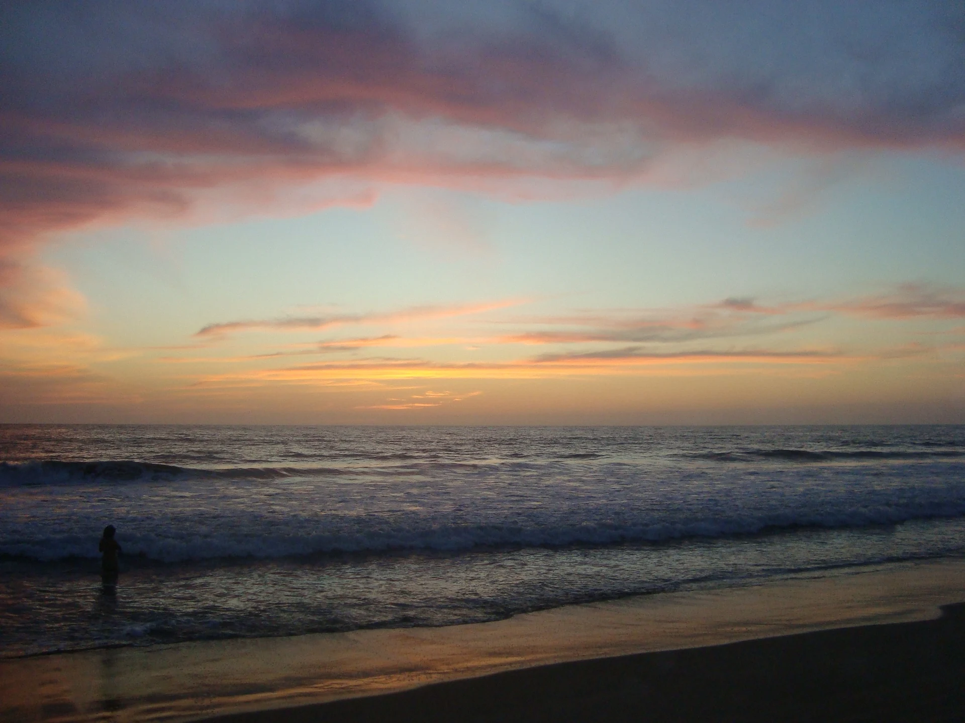 Sunset over the surf at Playa de las Tortugas, Nayarit